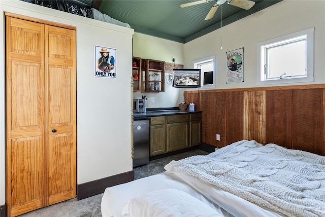 bedroom with refrigerator, ceiling fan, and carpet floors