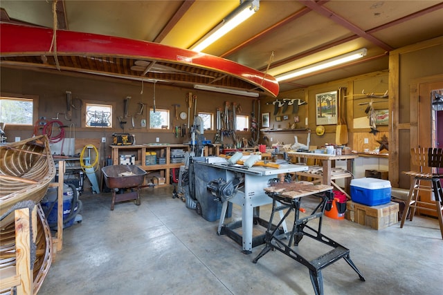 interior space with a workshop area and concrete flooring