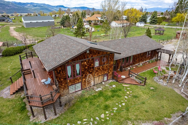 birds eye view of property with a mountain view