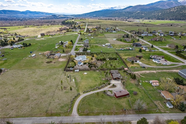 drone / aerial view with a rural view and a mountain view