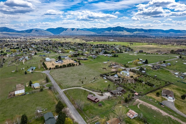 drone / aerial view with a mountain view and a rural view