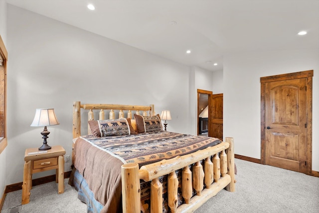 bedroom featuring light colored carpet, recessed lighting, and baseboards