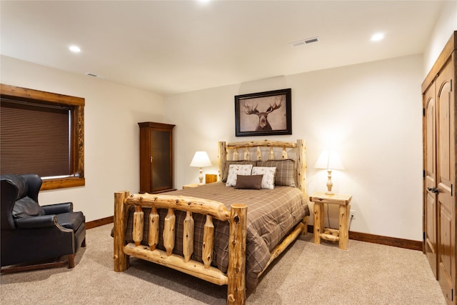 carpeted bedroom with visible vents, recessed lighting, and baseboards