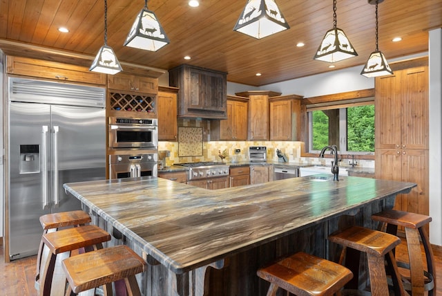 kitchen featuring light wood-style flooring, wood ceiling, decorative backsplash, appliances with stainless steel finishes, and a sink