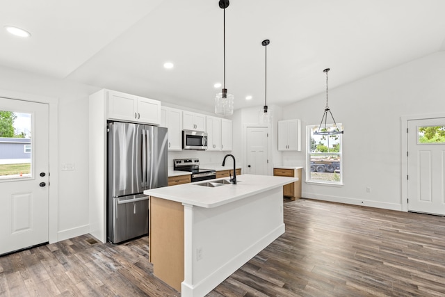 1503 3rd Ave NW, Great Falls, MT 59404 - kitchen featuring stainless steel appliances, a sink, recessed lighting, dark wood finished floors, and a kitchen island with sink