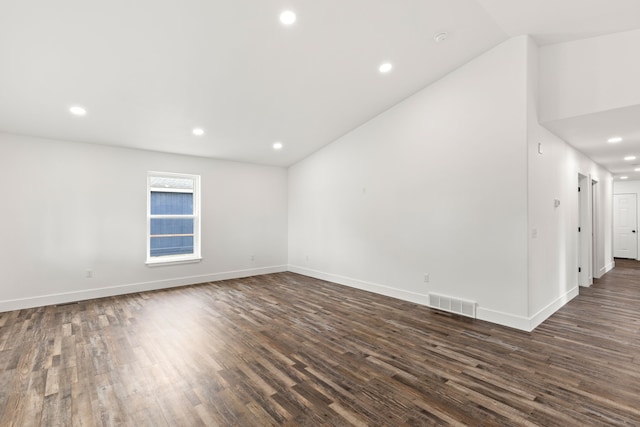 1503 3rd Ave NW, Great Falls, MT 59404 - empty room with dark wood-style floors, recessed lighting, vaulted ceiling, and baseboards