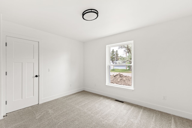 1503 3rd Ave NW, Great Falls, MT 59404 - spare room featuring carpet flooring and baseboards