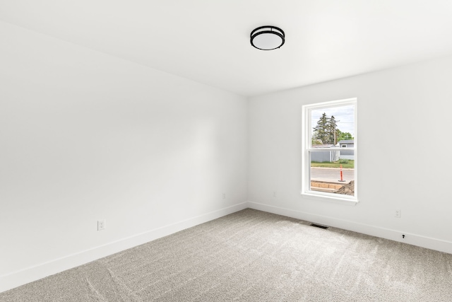 1503 3rd Ave NW, Great Falls, MT 59404 - spare room featuring carpet flooring and baseboards