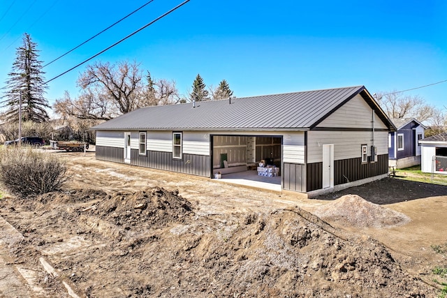 1503 3rd Ave NW, Great Falls, MT 59404 - back of house with a detached garage and metal roof