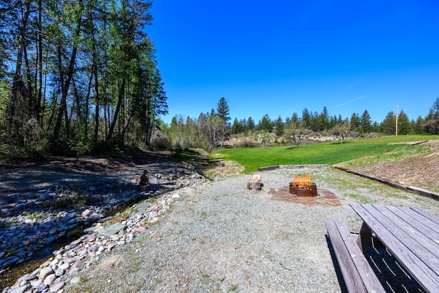 58386 Mt Highway 37, Rexford, MT 59930 - view of grassy yard with a fire pit