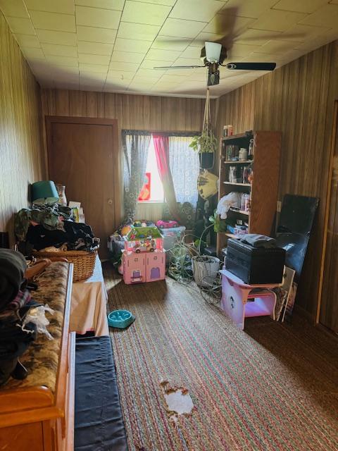 interior space featuring ceiling fan