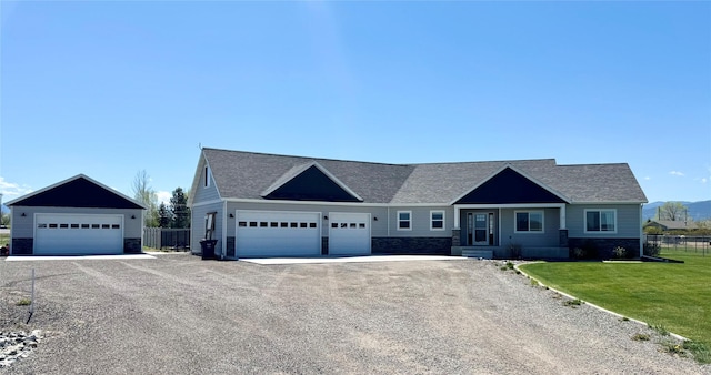 3554 Fasbender Ct, Helena, MT 59602 - single story home featuring stone siding, a shingled roof, and dirt driveway