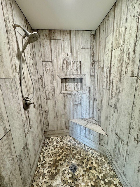 3554 Fasbender Ct, Helena, MT 59602 - full bathroom with wooden walls and tiled shower