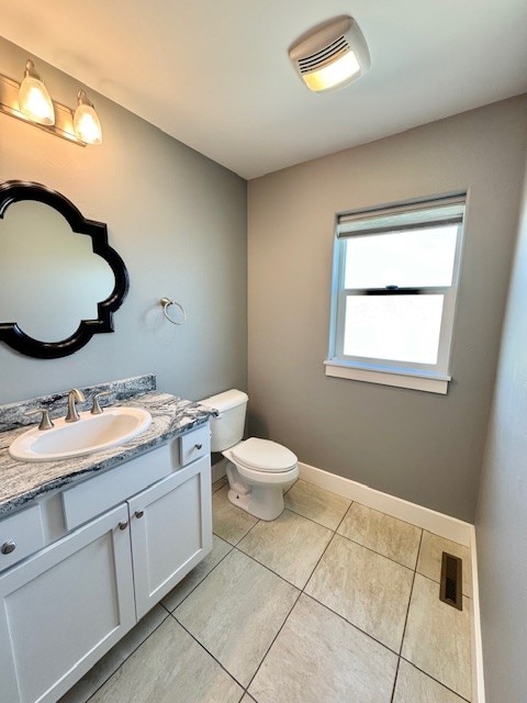 3554 Fasbender Ct, Helena, MT 59602 - half bathroom with vanity, tile patterned floors, and toilet