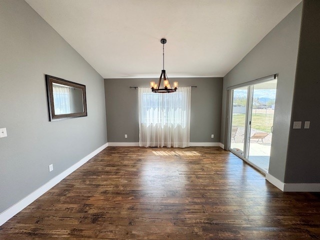 3554 Fasbender Ct, Helena, MT 59602 - unfurnished dining area with lofted ceiling, a chandelier, dark wood-type flooring, and baseboards