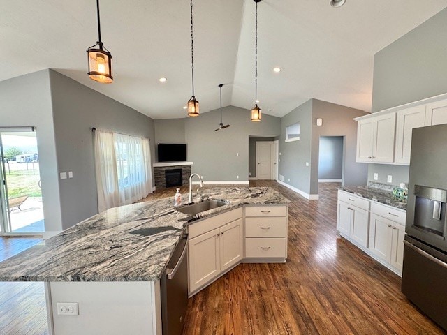 3554 Fasbender Ct, Helena, MT 59602 - kitchen with stainless steel appliances, open floor plan, a sink, lofted ceiling, and healthy amount of natural light
