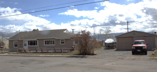 820 Lexington Ave, Butte, MT 59701 - view of front of house with a garage, fence, and an outbuilding