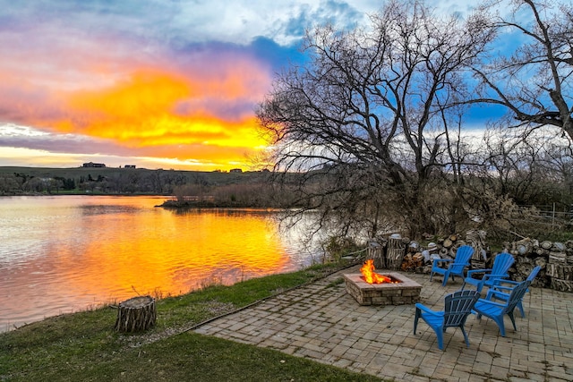 11 Wilson Butte Rd, Great Falls, MT 59405 - view of patio / terrace featuring a fire pit and a water view