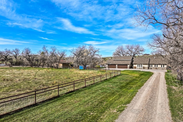 11 Wilson Butte Rd, Great Falls, MT 59405 - view of yard with dirt driveway and a garage