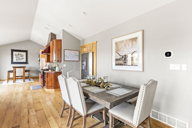 11 Wilson Butte Rd, Great Falls, MT 59405 - dining space featuring lofted ceiling and light wood-style floors