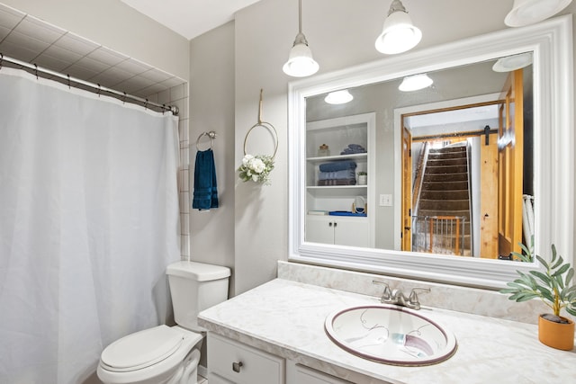 11 Wilson Butte Rd, Great Falls, MT 59405 - full bath featuring vanity, toilet, built in features, and a shower with shower curtain
