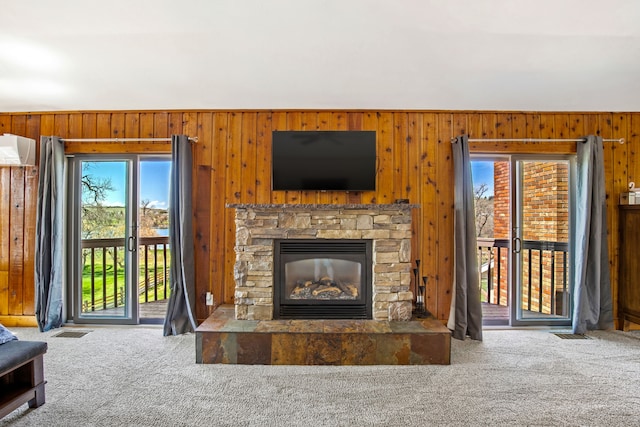 11 Wilson Butte Rd, Great Falls, MT 59405 - living room with carpet floors, wooden walls, healthy amount of natural light, and a fireplace