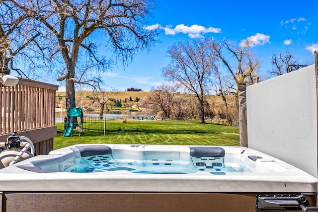 11 Wilson Butte Rd, Great Falls, MT 59405 - view of patio featuring a playground, a hot tub, and a water view