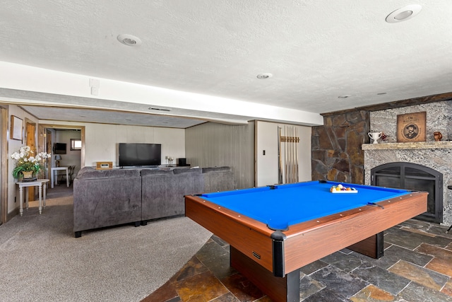 11 Wilson Butte Rd, Great Falls, MT 59405 - rec room featuring a textured ceiling, a stone fireplace, pool table, and stone finish flooring