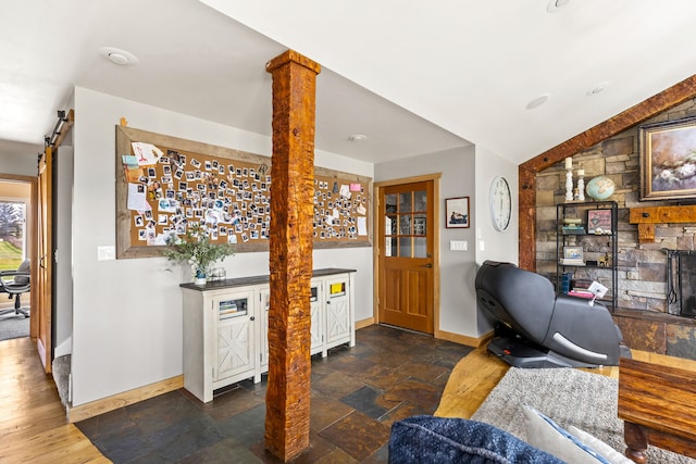 11 Wilson Butte Rd, Great Falls, MT 59405 - office area with baseboards, stone tile floors, and a barn door
