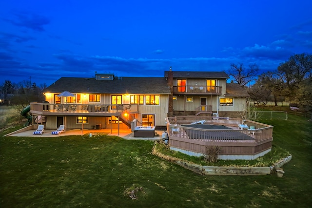 11 Wilson Butte Rd, Great Falls, MT 59405 - rear view of house with a balcony, a patio, a wooden deck, and a pool