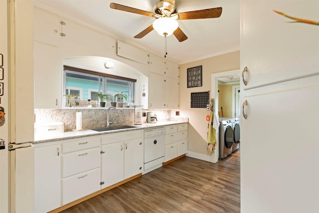 kitchen with washer and clothes dryer, a sink, tasteful backsplash, and dishwasher
