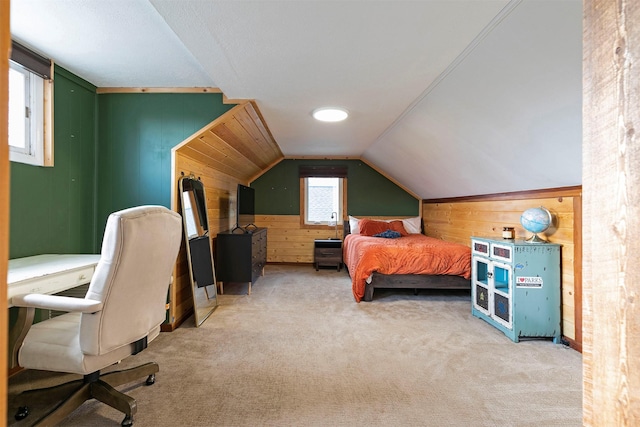 bedroom featuring carpet floors, wood walls, and lofted ceiling
