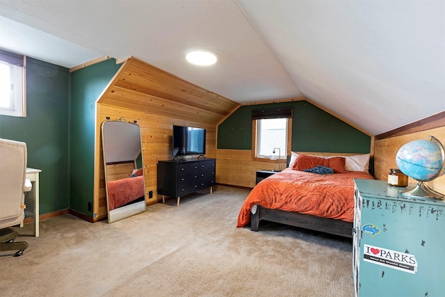 bedroom with wooden walls, light colored carpet, and lofted ceiling