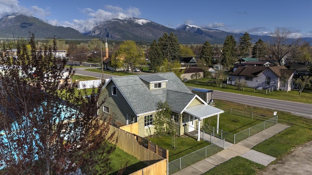 birds eye view of property with a mountain view