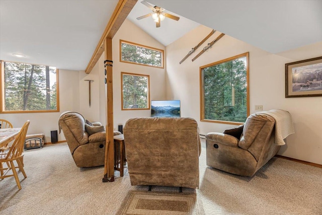 sitting room featuring ceiling fan, lofted ceiling, baseboards, and carpet
