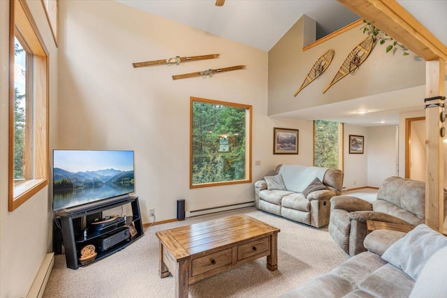 286 Antler Ridge Rd, Whitefish, MT 59937 - living room featuring baseboard heating, carpet flooring, plenty of natural light, and high vaulted ceiling