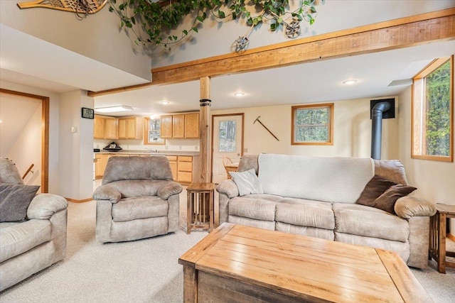 286 Antler Ridge Rd, Whitefish, MT 59937 - carpeted living area with a wood stove and recessed lighting