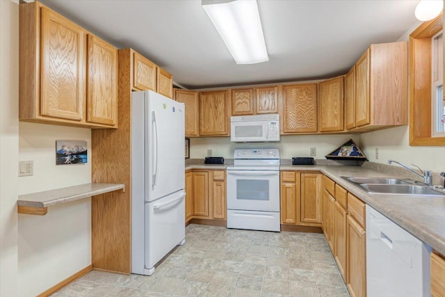 kitchen with a sink, light countertops, and white appliances