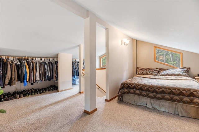 286 Antler Ridge Rd, Whitefish, MT 59937 - bedroom with carpet flooring, multiple windows, and lofted ceiling