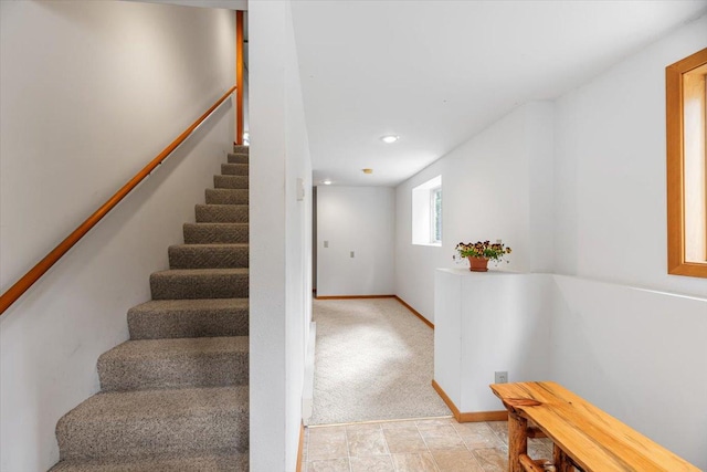 staircase with baseboards and recessed lighting