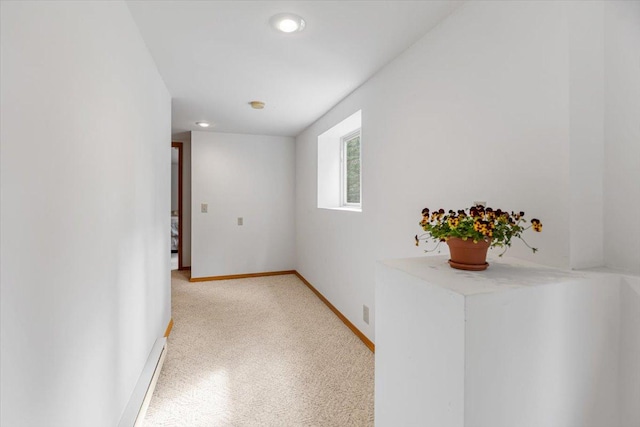 corridor with recessed lighting and baseboards