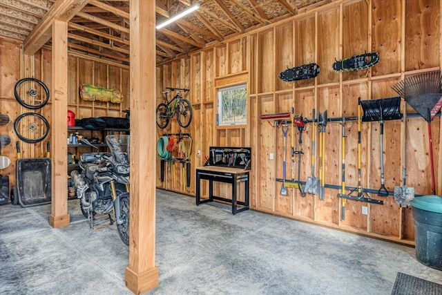 miscellaneous room with wooden walls