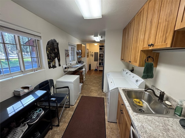 laundry room featuring a sink and washing machine and dryer
