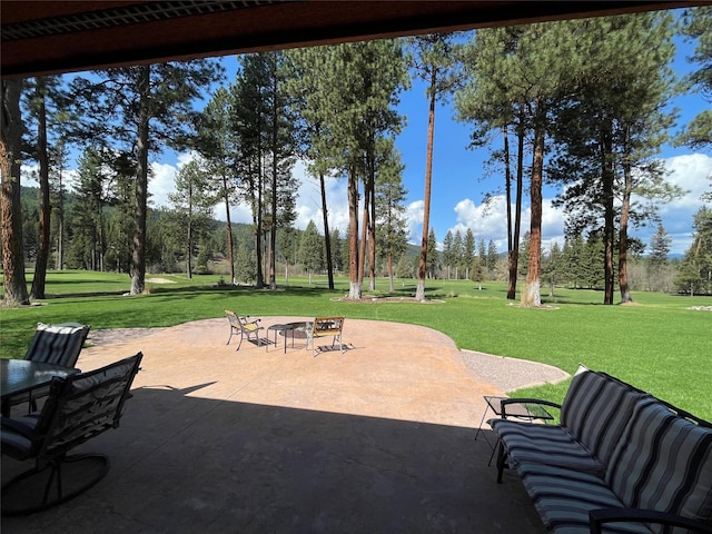 view of patio / terrace featuring an outdoor fire pit