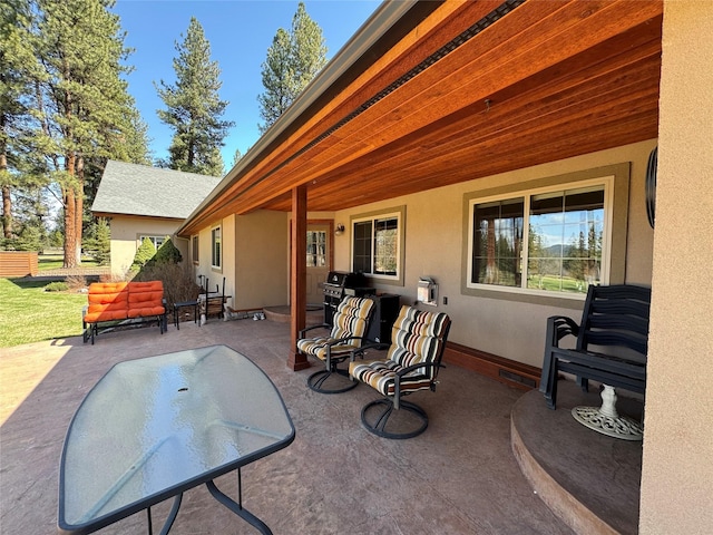view of patio / terrace featuring visible vents, fence, and a grill