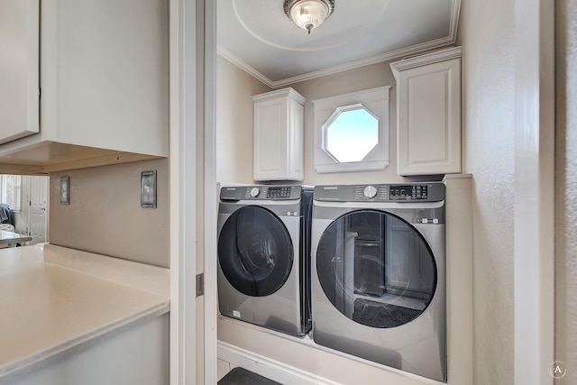 laundry area featuring separate washer and dryer and crown molding