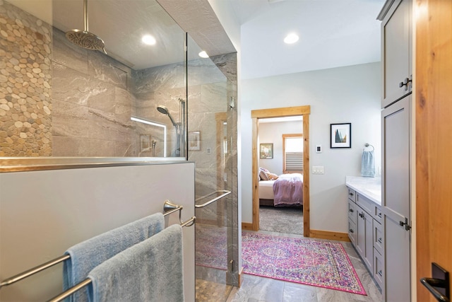 1207 Creek Crossing Rd, Missoula, MT 59802 - ensuite bathroom with a tile shower, vanity, and recessed lighting