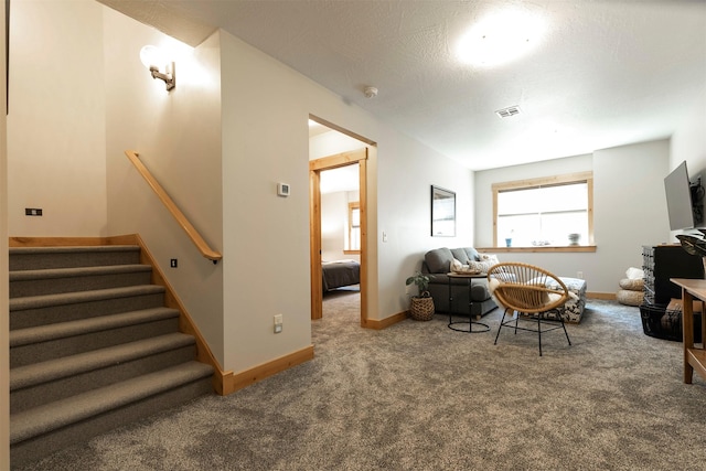 1207 Creek Crossing Rd, Missoula, MT 59802 - carpeted living area with baseboards and stairway