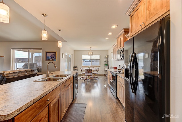 3875 Saint Marys Rd, East Helena, MT 59635 - kitchen with black appliances, brown cabinets, dark wood finished floors, healthy amount of natural light, and recessed lighting
