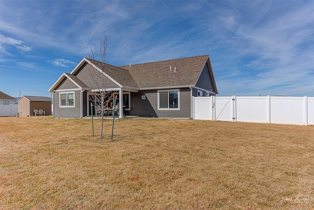 3875 Saint Marys Rd, East Helena, MT 59635 - rear view of house with a gate and a shingled roof
